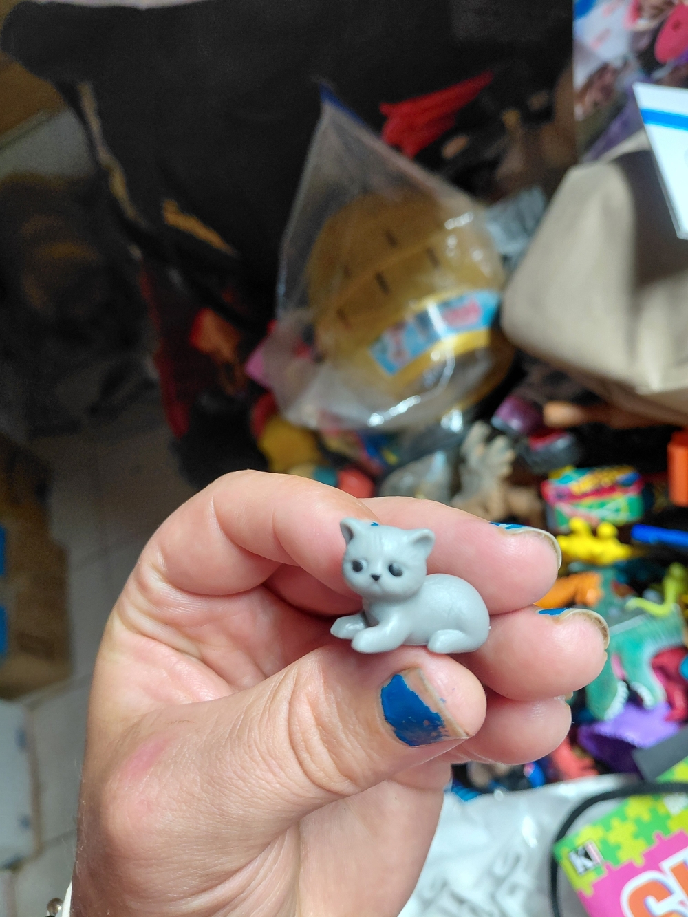 Pocket paws miniature toy plastic figurine resting grey cat - common